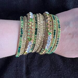 Stunning stack of gold and green gemstone bangle bracelets